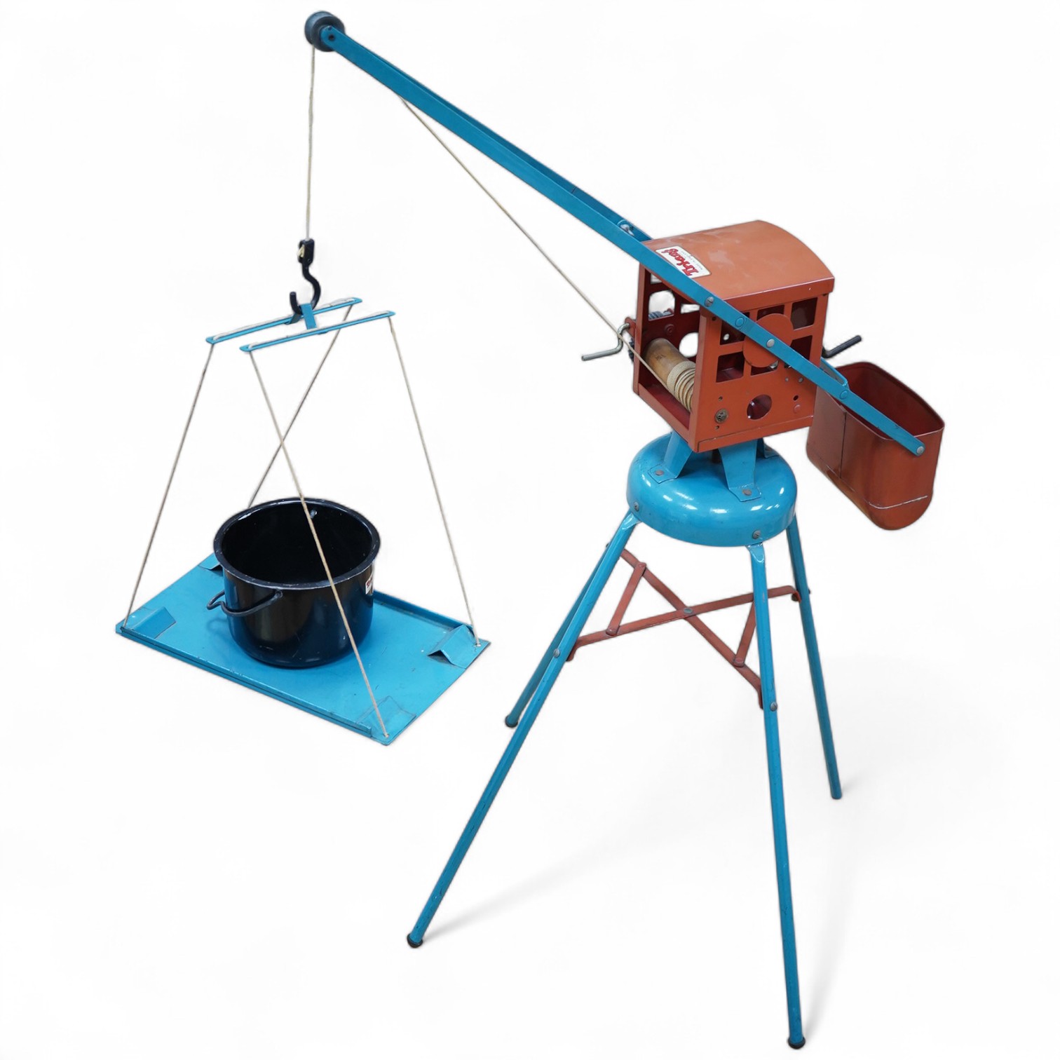 A 1950s Tri-ang large scale tinplate dockside crane with accessories including; a metal bucket, a plastic wrecking ball, etc. 88cm high to top of cab. Condition - fair to good, small patches of surface rust and some mino